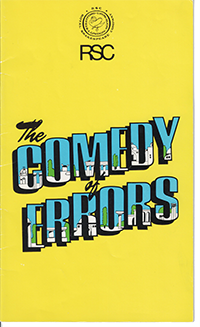 Tall yellow book with the RSC logo at the top and "The Comedy of Errors" diagnoally in the center, the words "Comedy" and Errors" comprising a landscap of Greek architecture against a blue sky.
